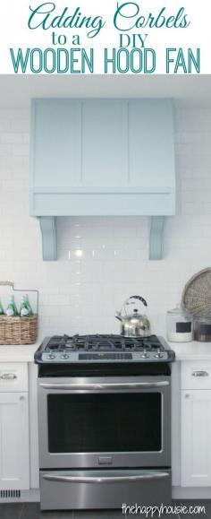 Add corbels to a wooden hood fan. Cute oven/stove with blue hood and white subway tiles.