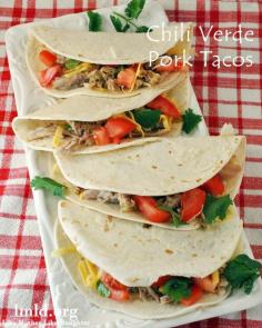 Chili verder pork tacos. The meat in these tacos is so flavorful and moist cooked in the crock pot all day! #lmldfood