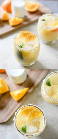 Coconut Creamsicle Margaritas Ingredients: 2 ounces grand marnier, 2 ounces orange juice, 1 1/2 ounces silver tequila, 1 ounce lime juice, 1 ounce coconut water, 1 ounce canned light coconut milk, 1 ounce simple syrup unsweetened shredded + toasted coconut for glass rims orange + lime slices for serving