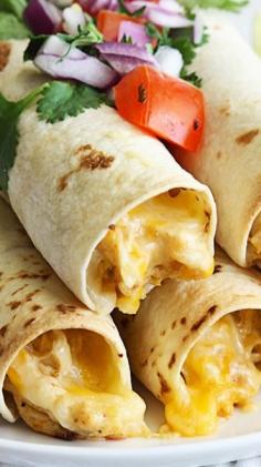 SLOW COOKER CREAM CHEESE CHICKEN TAQUITOS RECIPE: 2 chicken breasts that are boneless and skinless - 1 tspn chili powder - 1 tspn garlic powder - 1 tspn cumin - some salt and pepper - 1/2 lbs cream cheese - 1 cup of water - 1/2 cup of shredded colby or Mexican blend cheese - 10 to 12 6 inch tortillas(flour or corn) extras: cilantro, salsa, sour cream or your preferred toppings