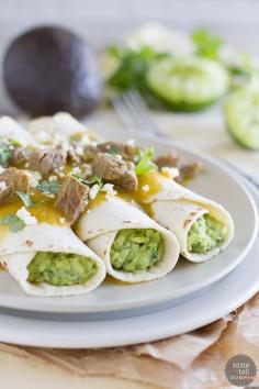 These guacamole tacos have flour tortillas filled with an easy guacamole, then served with a tomatillo sauce that is filled with chunks of steak.