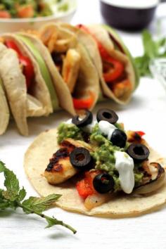 Greek inspired tacos, made on the grill - perfect veggie option at your next barbecue! (Make sure to use pure corn tortillas to ensure they are gluten free)