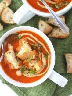 Roasted Red Pepper Soup with Tahini Swirl and Garlic Bread Croutons - This flavorful vegan roasted red pepper soup is made with ripe summer red bell peppers, lots of paprika and is topped with creamy tahini sauce and crispy broiled garlic croutons.