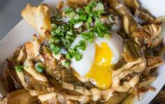 
                    
                        Minnesota State Fair: Kimchi n’ Curry Poutine - 10 Foods Not to Miss at State Fairs This Summer | Travel + Leisure
                    
                