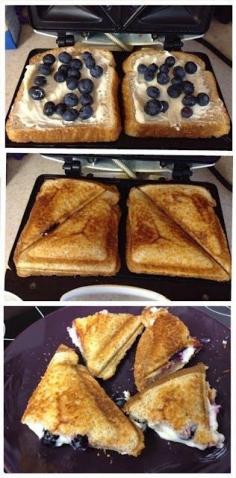 Blueberry Breakfast Grilled Cheese! Make french toast first :) Cream cheese, powdered sugar, blueberries, bread.