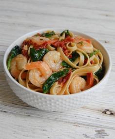 
                    
                        Shrimp Scampi with Sun-Dried Tomatoes-shrimp are sautéed in a lemon garlic butter sauce with crushed red pepper flakes and tossed in a fettuccine with spinach and sun-dried tomatoes.// A Cedar Spoon
                    
                