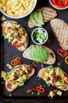 
                    
                        Breakfast Bruschetta topped with scrambled eggs, salty bacon, sweet peppers, all on a creamy Avocado Toast! These are so stinking good! The perfect Saturday morning breakfast or brunch recipe. | joyfulhealthyeats...
                    
                
