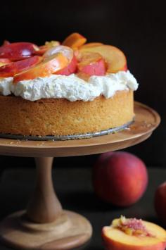 A light and elegant Olive Oil Honey Cake with fresh homemade whipped cream, sliced peaches and lightly drizzled with honey. Dessert doesn't get any better than this. #cake #peaches #yum