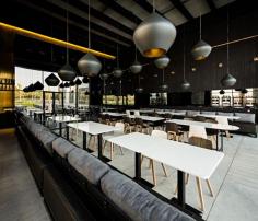 
                    
                        Ubon Murouj "A monolithic black mirrored wall in the dining area created a subtle reflection of the surrounding environment while concealing the mechanical services & ducting."
                    
                