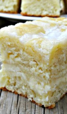 Cream cheese coffee cake recipe ~ The cake is moist and buttery, with a cheesecake like swirl in the middle, some texture from the streusel and sweetness from the powdered sugar glaze #creamcheese #coffeecake
