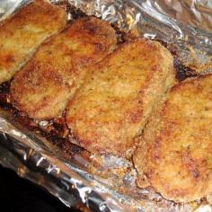 Parmesan Pork chops  4 boneless pork chops  1 T. olive oil  1 C. parmesan cheese (I used Kraft)  1 C. Italian bread crumbs  1 tsp. pepper  1 tsp. garlic powder.  Dip in olive oil and coat with mixture.   Line pan with foil and spray. Bake 350 degrees for 40-45 min.
