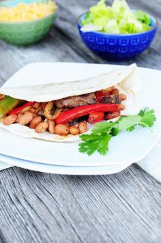 
                    
                        Steak and Bean Fajitas - Steak Fajitas with Bush's Pinto Beans with Bacon creates a filling and delightful weeknight dish! Recipe from dineanddish.net
                    
                
