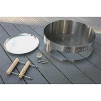Transform kettle grill into a pizza oven Durable 20-gauge, 304-grade stainless steel Works with charcoal- and wood-burning grills Kit includes sleeve, handles, thermometer, pan Dimensions: 22.5 diam. inches. Forget delivery. Get your grill - and your family - fired up for gourmet pizza in your own backyard with this KettlePizza Basic Kit for 18.5 and 22.5 in. Kettle Grills. Crafted with durable 20-gauge 304-grade stainless steel this kit's round sleeve fits on top of your kettle grill to create a charcoal- or wood-burning pizza grill. Simply prep your pizza and slide it in through the built-in entry window - heat levels remain stable inside because you don't have to remove the grill lid to access what's cooking. Also in the kit are two wood handles a high-temperature thermometer one 14-inch aluminum pizza pan and hardware. Includes a 90-day manufacturer's warranty. About KettlePizzaKettlePizza started in 2010 by someone just like you - someone who wanted delicious pizza from the grill without going to an overwrought restaurant or shelling out thousands for a built-in outdoor oven. Al and George started prototyping on their Weber kettle in the backyard eventually perfecting the go-anywhere pizza oven. Plenty of people noticed and today KettlePizza serves customers all over the world out of a large Massachusetts facility where they still make everything by hand with American components. The unique design keeps heat in and creates the invaluable convection that's needed for a perfectly cooked pizza and it uses the grill you already have. Innovation is delicious.