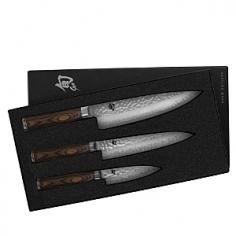 VG10 steel core with Damascus pattern stainless-steel Oblong walnut pakkawood handle for comfort Ideal starter set for newlyweds chefs or as an upgrade Hand-wash for best performance Includes 4-inch 6.5-inch and 8-inch knives gift box. The ideal gift set for newlyweds new home owners and the budding chef or for upgrades in your own kitchen the Shun Premier 3 Piece Starter Set is sure to please any recipient. With VG10 steel core construction and 32 layers of stainless Damascus these knives each have a 16-degree convex ground edge for precise cutting power. Beveled for lateral stability and incredible precision the knives makes it easy for you to navigate your way through many chopping tasks in style. This set includes a 4-inch paring knife a 6.5-inch utility knife and an 8-inch chefs knife. The striking hammered finish called tsuchime in Japanese acts similarly to a series of hollow-ground cavities reducing drag and quickly releasing foods from the blade so you can quickly move from one task to another. The walnut pakkawood handle nestles comfortably in your hand balanced with the beautiful Shun logo embossed on the bottom end. Whatever the occasion you are sure to love giving (or receiving) these carefully crafted knives because of their exquisite style and the precision with which they cut. Set includes: 4-inch paring knife 6.5-inch utility knife 8-inch chefs knife About KAI USA Ltd. For more than 100 years the highly skilled artisans of KAI USA Ltd. home of Kershaw knives and Shun cutlery have been producing blades of unparalleled quality in the spirit of the legendary swords smiths of Japan. For more than three generations they have been dedicated to listening to the voices of customers and providing products that contribute to a more tasteful life. Incredibly sharp edges partnered with a stunning aesthetic set Shun and Kershaw knives apart from others. A tradition of excellence combined with the newest technology and advanced materials makes every knife a functional work of art.