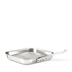 Griddles & Grill Pans - This tri-ply stainless-steel grill pan features the exacting detail that has made All-Clad the premier cookware in professional kitchens. With 25% more cooking surface than a traditional round grill pan, this All-Clad cookware lets you enjoy juicy grilled steaks, hamburgers or delicious seafood entrees any time of the year. The sides of this grill pan are straight and high, with corners, to easily flip or turn foods. All-Clad tri-ply construction is unsurpassed in the industry, with pure aluminum core that extends up the sides, ensuring the even heating and superior cooking performance that has gained international recognition in the industry. Designed for quick cooking using a small amount of oil or butter, this All-Clad cookware is the true connoisseur's choice for sauteing, browning and searing. All-Clad's leading cookware line is brilliantly styled with a hand-polished gleaming stainless-steel finish that many of the world's professional and home chefs prefer. The 18/10 stainless-st - Specifications Model: 8701005109 Material: stainless-steel with pure aluminum core, stainless-steel rivets and handle 11" Sq. (19 1/2"L w/handle) x 1 1/2"H Base: 9 1/4" Sq. Weight: 2-lb, 14-oz. Made in the USA Lifetime manufacturer warranty All-Clad Cookware Lifetime Warranty: From date of purchase, All-Clad guarantees to repair or replace any item found defective in material, construction or workmanship under normal use and following care instructions. This excludes damage from misuse or abuse. Minor imperfections and slight color variations are normal. Care and Use Dishwasher-safe. Oven-safe and broiler-safe. Suitable for all cooktops, including induction. Preheating pan for 1-2 minutes over low or medium heat is recommended, prior to adding food. To prevent water spotting, rinse in hot water and dry immediately. Overheating can cause brown or blue stains to appear. Food films, if not removed, will cause discoloration on the pan when