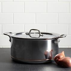 An essential for every kitchen and available in a variety of sizes, the stockpot features high sides that slow the evaporation of liquids, providing the ideal design for creating a variety of stocks. The wide bottom of the pan allows for sauteing of ingredients before the addition of liquids for delicious soups and stews. Stockpots are also well-suited for canning, blanching, and preparing food in large quantities. - Copper center core maximizes heat conductivity and responsiveness Distinctive exposed copper band adds design elegance Rolled edges for drip-free pouring Engraved capacity marking on the bottom of every pan Rapid and even heat distribution Easy grip riveted loop handles provides stability Size: 14.1" x 11.6" x 5.5" Capacity: 8 QT. Weight: 9 lbs.