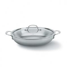 You'll get a lot of use out of the versatile Calphalon 12-in. Stainless Steel Everyday Pan. Its sloping sides resemble a skillet, so you can use this pan for sautéing vegetables, caramelizing onions and making omelets. Its low-profile sides make it great for oven-to-table dishes such as paella, risotto and pasta dishes. Toss you homemade tomato sauce with your penne in this stainless steel pan just before serving. This pan features handles that stay cool even when you cook over a high heat. Because there are two handles, you'll be able to carry the pan easily even when it's full. The tri-ply construction, with an aluminum core housed in two layers of stainless steel, allows the pan to conduct heat well. You'll be able to control the temperature of the pan with a simple adjustment on your stove. Because the pan heats evenly, your food will cook perfectly, with no burned spots and cold spots. This durable pan can be used on any type of stovetop, including gas, electric, induction, ceramic and halogen. You can even use the pan in the oven or under your broiler. Sear your meat on the stovetop and then transfer it to the oven for the remainder of the cooking time. Thanks to its durability, you can use all types of utensils, even metal ones, with the pan. With its dome shape, the lid returns moisture to your food as the steam cools. Run the pan and the lid through the dishwasher for easy cleanup.