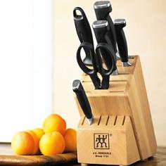 Made of long-lasting stainless steel. Laser-controlled edge is sharper and stays sharper longer. Molded polypropylene handles for comfortable and safe use. Includes Henckels steel, hardwood knife block, and more. Dimensions: 16.75L x 9.75W x 5.5H in. Enjoy a full set of valuable cutlery with the Zwilling 4 Star II 7 Piece Block Set. This set includes a variety of indispensable knives, each with hardened stainless steel blades, molded poly handles, and full tang design. It comes compete with a display block, shears, and honing steel. About Zwilling JA Henckels: JA Henckels has been producing the best in German steel knife design since 1895. Their products are designed for everyday use, giving you the maximum value for your money. This modern company uses innovative technology to create the highest-quality products. They're so sure you'll be satisfied with their products that they back each one with a lifetime warranty. With several lines of quality cutlery and other products, you're sure to find the perfect housewarming or wedding gift, or addition to your own kitchen. About Zwilling Four Star II: Knives get a workout every day, whether used on a cutting board to prep food or at the dinner table to slice steaks, chops, and other meat. Whether it's a cleaver or carver, the quality knives in the Zwilling J.A. Henckels Four Star II collection feature improved weight and balance, as well as permanently bonded polypropylene handles for a secure, comfortable grip. Stainless-steel end caps on the handles provide excellent balance while cutting.