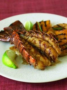 Grilled lobster tail with tropical fruit. Butterflied lobster tail with pineapple, mango and bananas grilled on gas.