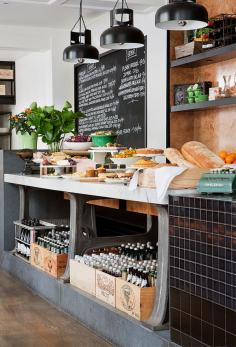 I love the wooden wine boxes at the bottom and industrial feel of this display. dustjacket attic: Weekend Musings (Me too!)