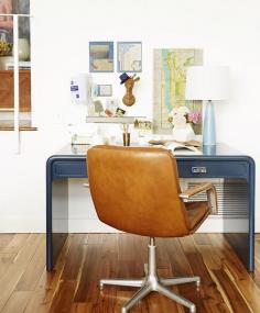 Blue waterfall desk and caramel leather chair