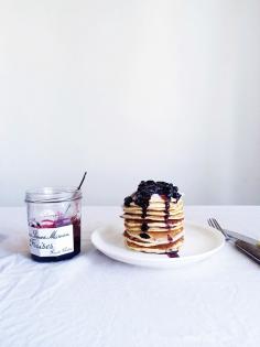 Pancakes with blueberry jam and vanilla powdered sugar