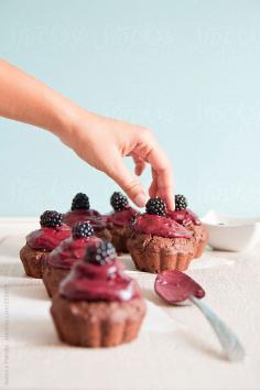 Chocolate muffins with blackberry frosting