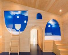 Children’s nook-like bedrooms are connected by tunnels