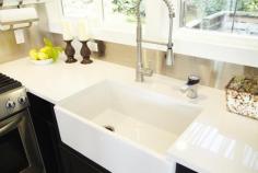 The countertops are a Caesarstone product from Ikea, while the farmhouse sink is from Home Depot.