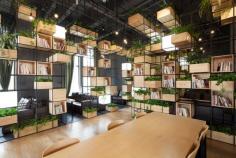 Architecture firm Penda have designed the interiors of Home Café, using recycled steel bars as dividers.