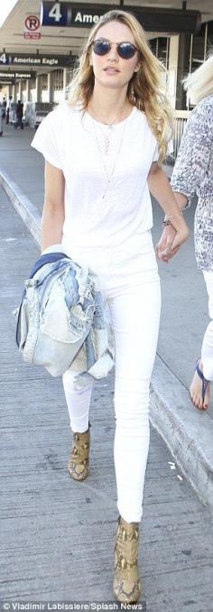 Victoria's Secret beauty Candice Swanepoel flies into LA all in white #dailymail