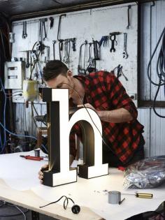 Melbourne lighting designer Daniel Giffin working on his ‘H’ light. Photo – Eve Wilson for thedesignfiles.net