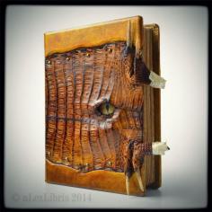 clever & creepy. At least for me. especially since it's genuine gator.  alexlibris-bookart:      New project in work phase…      House Targaryen Journal - 10 x 8 inches - thickness 1.5 inches - genuine alligator leather - glass eye - chains - dragon claws closure system - etc.     _________     www.alexlibris-bo...