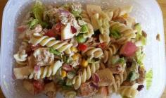 Chicken, tuna, beans, apples, peppers, corn, cucumber and lettuce pasta salad