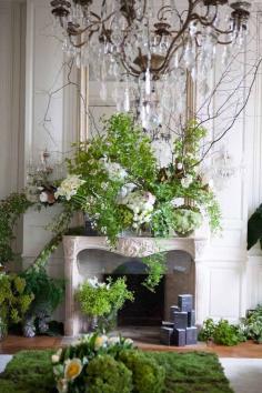 Ornate Fireplace Mantle floral design of all green foliage and white flowers. Designer Unknown