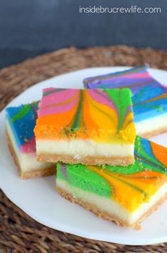 
                        
                            Rainbow Vanilla Cheesecake Bars - vanilla cheesecake with a fun rainbow swirl.  Fun, festive, and perfectly delicious!
                        
                    