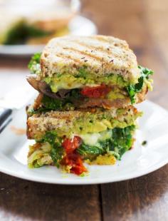 
                    
                        This avocado veggie panini is stuffed with lots of sauteed mushrooms, tomatoes, and kale, and smeared with avocado. 300 calories.
                    
                