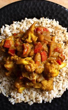 African Veg Curry. Ingredients: cauliflower, red pepper, red onion, olive oil, garlic, curry, cinnamon, salt, cumin, clove, coriander, turmeric, paprika, garbanzo beans, zucchini, vegetable broth