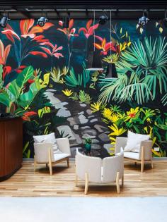 
                    
                        Arroyo Hotel — Buenos Aires | colourful mural backdrop to pale grey furnishings and pale timber floor.
                    
                