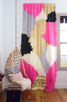 Love the rattan swing and those curtains are so much fun for a girls room!