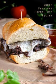 Under Pressure French Dip Sandwich Recipe from Confectionalsim (technically a pressure cooker recipe, but would adapt very readily to crockpot, all day on low)