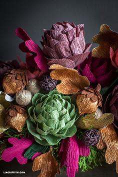 I love how these crepe paper artichokes turned out. The pliability and soft colors of the Carte Fini crepe paper gives it a very organic and yummy feel. Don’t they look like they came straight from my garden? I will have to watch myself to make sure I don’t just plop them into a pot of boiling water. You all know my love for paper flowers and the delicious little artichoke is actually an edible flower from a thistle-like plant in the sunflower family native to the Mediterranean.  #crepepaper #papercraft #diy