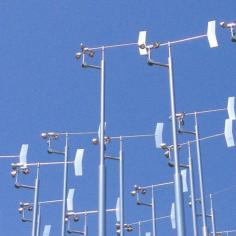 
                    
                        Delicate group of chrome-colored wind vanes shimmer in the California sunshine.
                    
                
