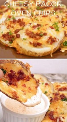 
                    
                        Cheesy Bacon Oven Chips 1 large, uniformly-shaped russet potato, scrubbed well and sliced into 1/8" rounds* cooking spray 3/4 C. shredded colby jack or cheddar cheese salt & pepper to taste 2 T. crumbled bacon (about 2 slices) - chopped parsley or chives, for garnish (optional)
                    
                