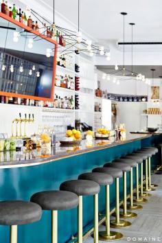 
                    
                        The Upsider NYC // Bar design with gray and brass barstools and teal accents.
                    
                