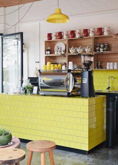 
                    
                        Melbourne deli Hams and Bacon - yellow counter tiles, coffee machine trim and cups - SO cheery.
                    
                
