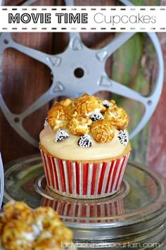 
                    
                        A vanilla cupcake with caramel butter frosting topped with fun movie treats.
                    
                