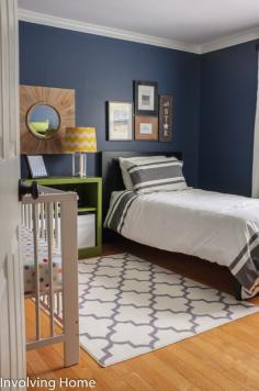 Navy, green, and gray boy nursery ideas with crib and twin bed