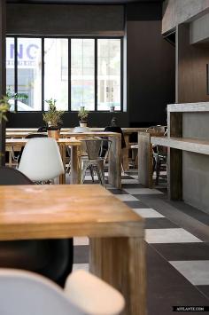 
                    
                        Musique Cafe, Athens. Checkered flooring, tolix chairs, repurposed timber, aluminium pot plants. Rustic industrial.
                    
                