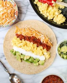 Easy Breakfast Burrito- packed with protein and flavor, a tasty way to start a busy school day. #breakfast #backtoschool Check out more recipes like this! Visit http://yumpinrecipes.com/